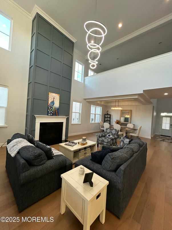 Dining room, Fireplace, Interior, Living room, Pendant Lights, Recessed Lighting, Wood Texture Flooring