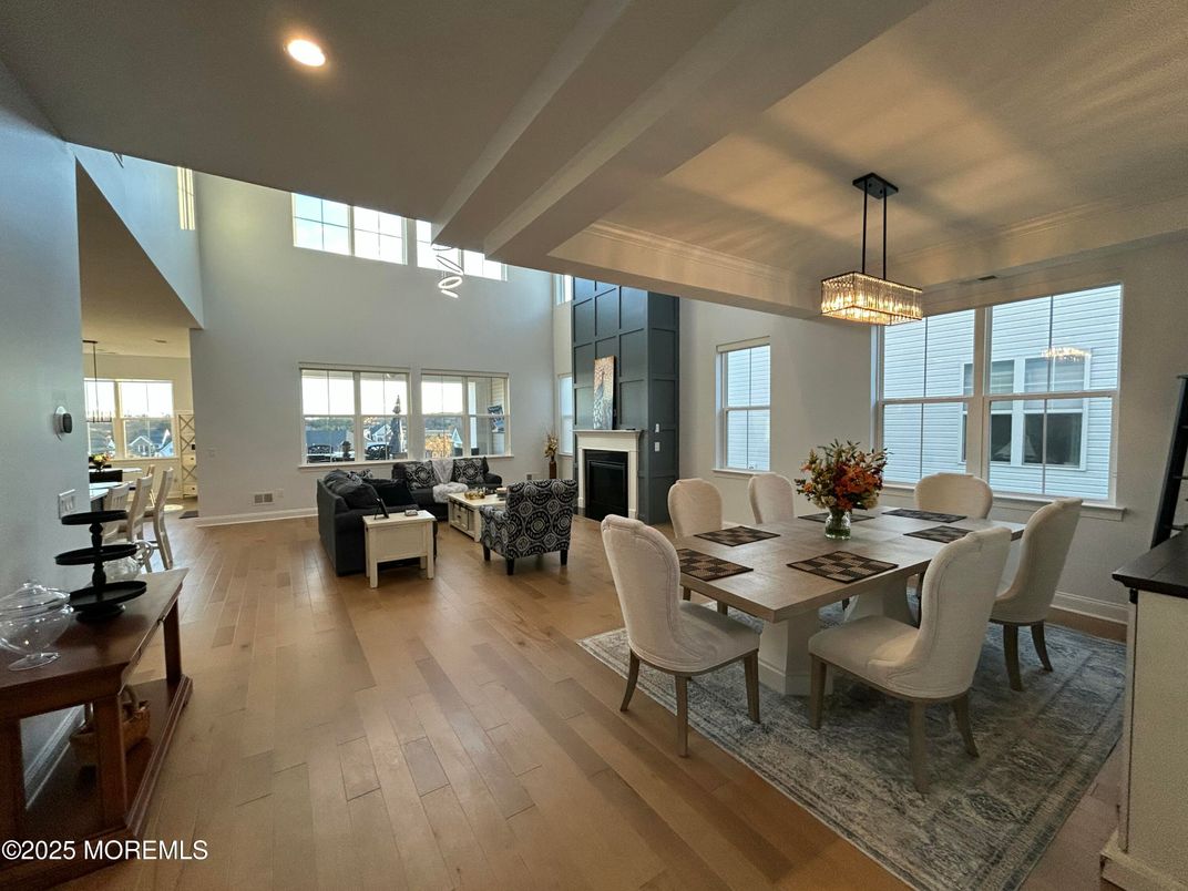 Dining room, Fireplace, Interior, Living room, Pendant Lights, Recessed Lighting, Wood Texture Flooring