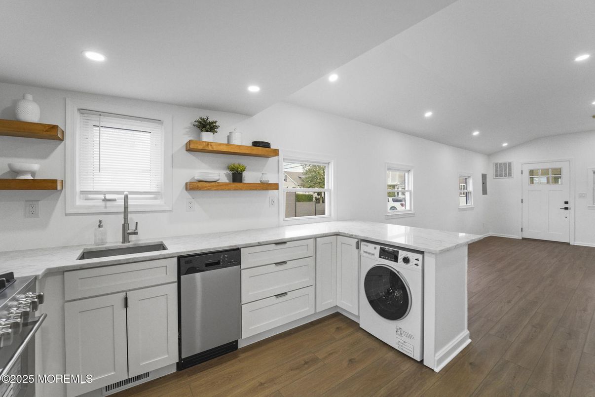 Interior, Kitchen, Recessed Lighting, Washer, Wood Texture Flooring