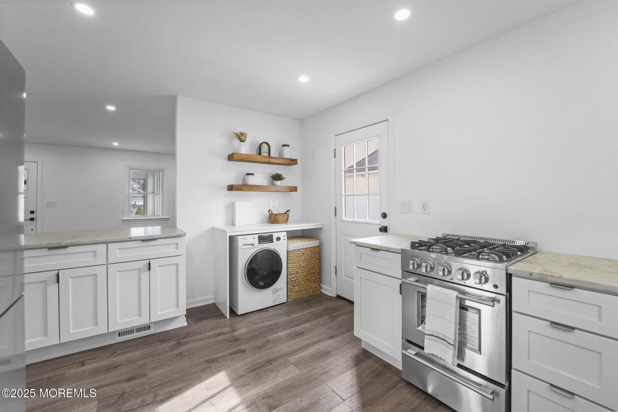 Interior, Kitchen, Recessed Lighting, Washer, Wood Texture Flooring