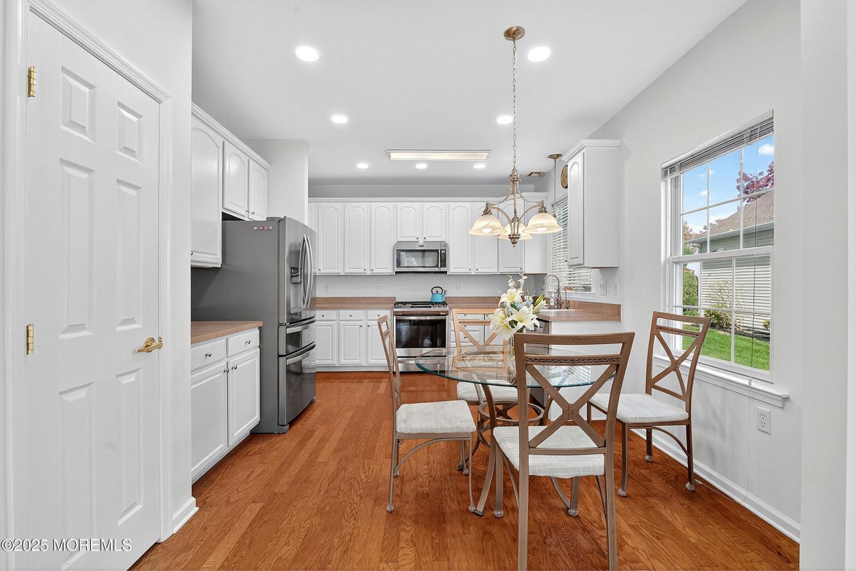 Dining room, Interior, Kitchen, Pendant Lights, Recessed Lighting, Stainless Steel Appliances, Wood Texture Flooring