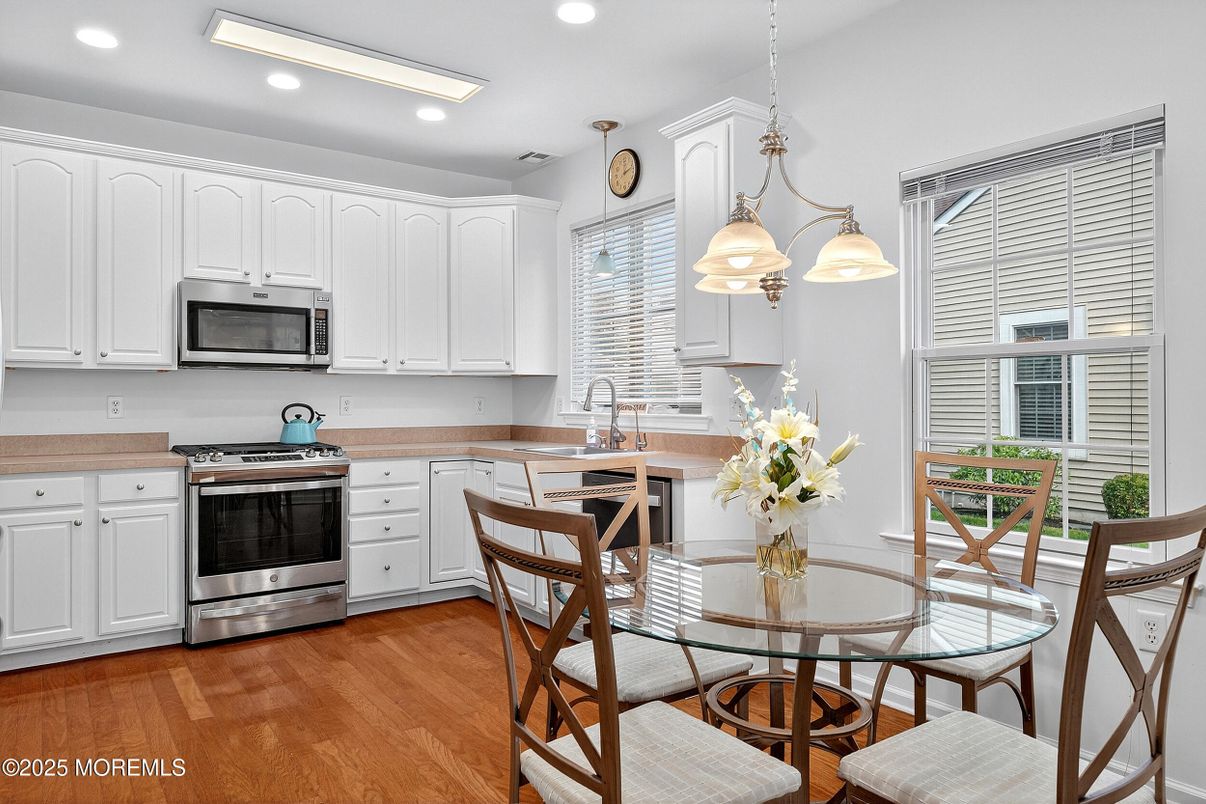 Dining room, Interior, Kitchen, Pendant Lights, Recessed Lighting, Stainless Steel Appliances, Wood Texture Flooring