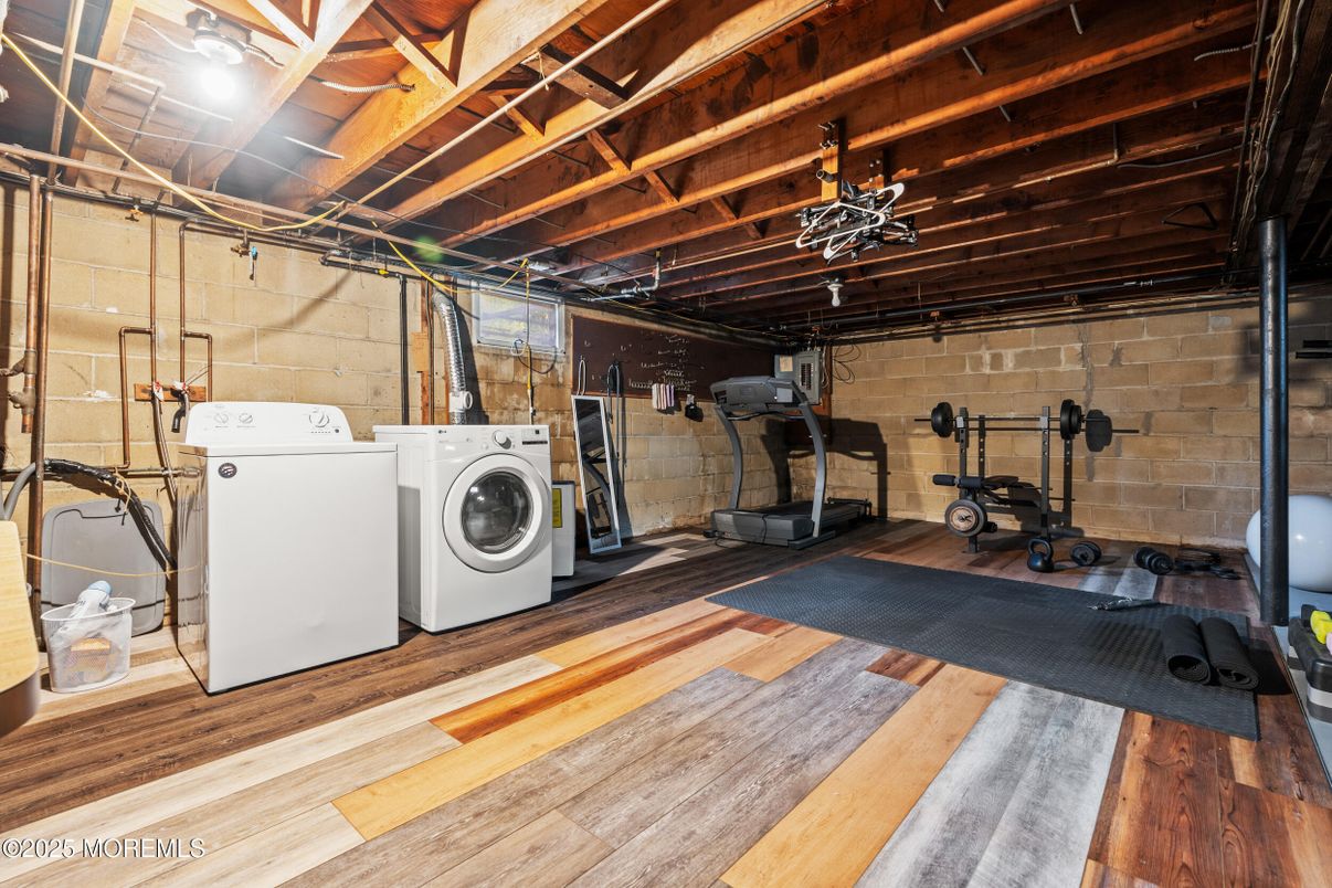 Fitness Equipment, Interior, Stone Walls, Utility Closets, Washer, Wooden Beams, Wood Texture Flooring