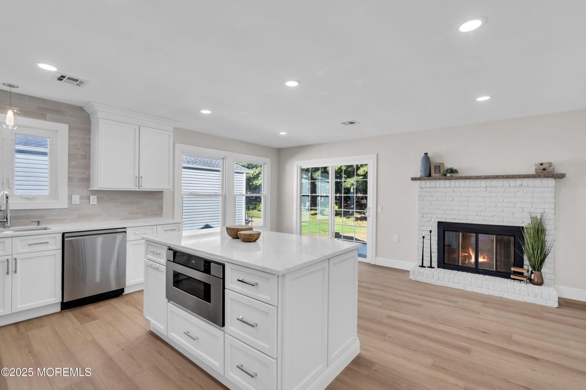 Fireplace, Interior, Kitchen, Pendant Lights, Recessed Lighting, Stainless Steel Appliances, Wood Texture Flooring