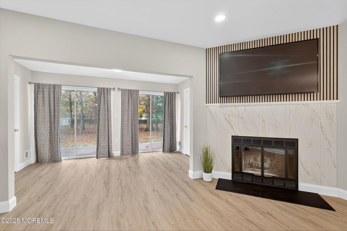 Fireplace, Interior, Marble Walls, Recessed Lighting, Wood Texture Flooring
