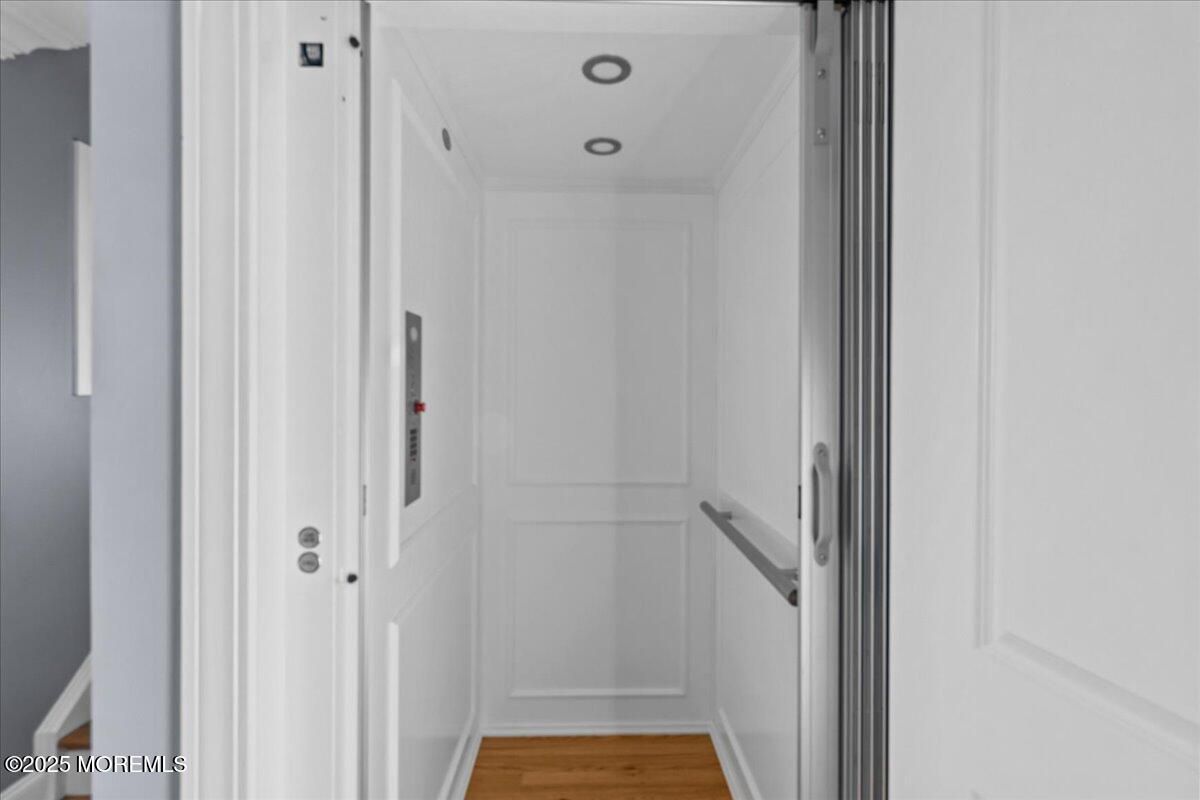 Elevator, Interior, Recessed Lighting, Wood Texture Flooring