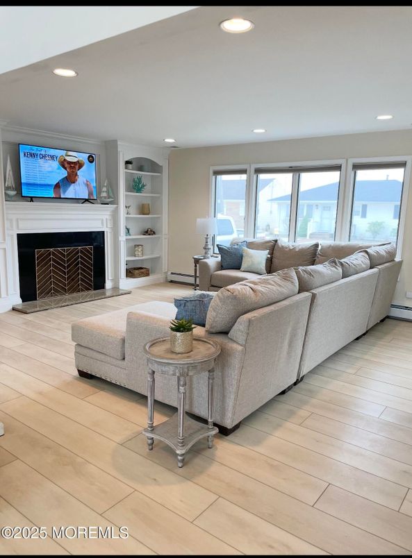 Fireplace, Interior, Living room, Recessed Lighting, Water, Wood Texture Flooring