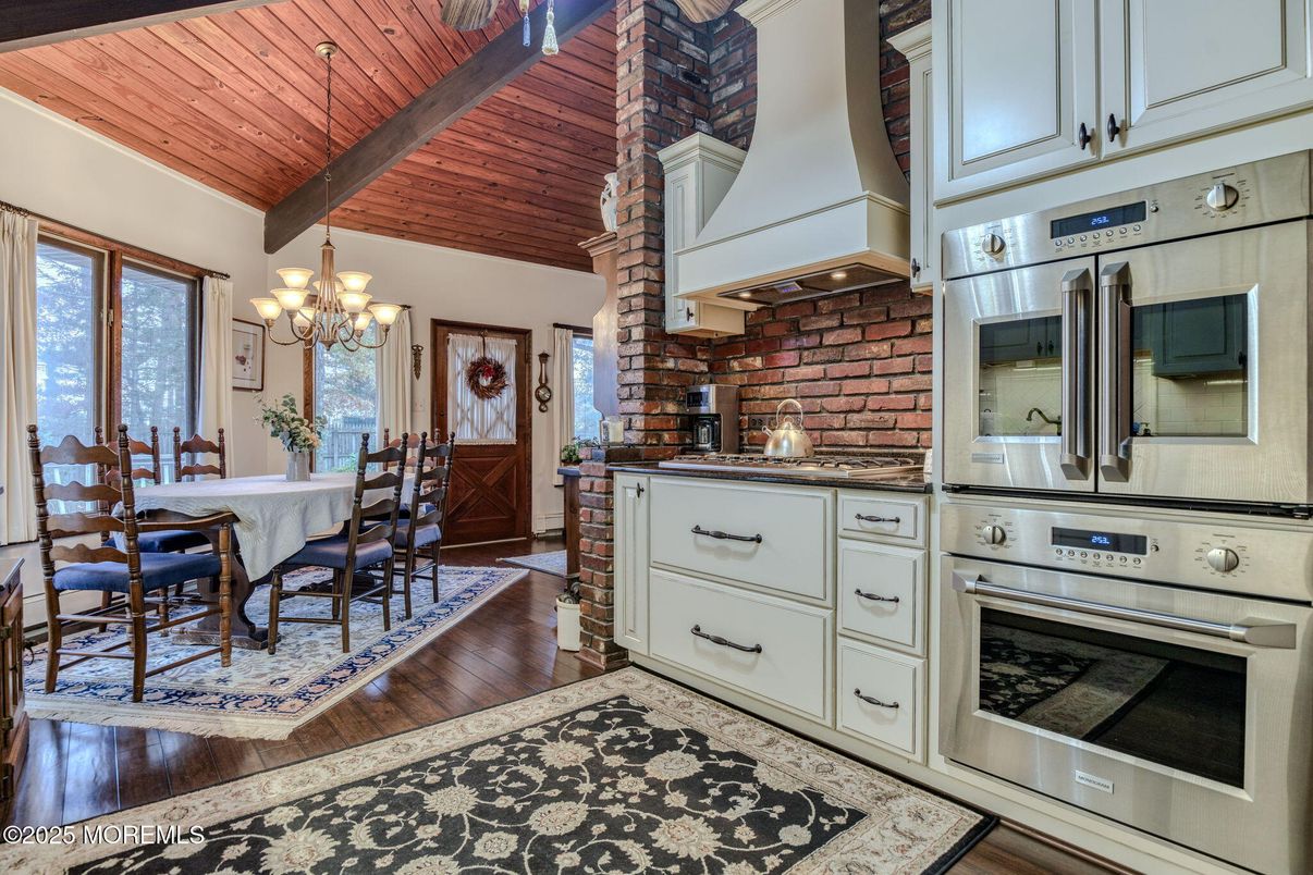 Chandelier, Dining room, Interior, Kitchen, Stainless Steel Appliances, Stone Walls, Wooden Beams, Wooden Ceilings, Wood Texture Flooring