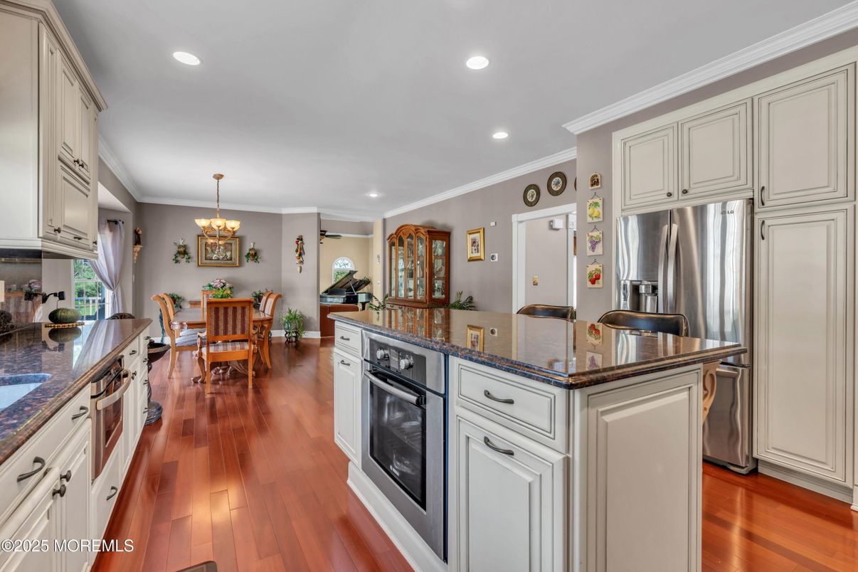 Chandelier, Dining room, Interior, Kitchen, Recessed Lighting, Stainless Steel Appliances, Wood Texture Flooring