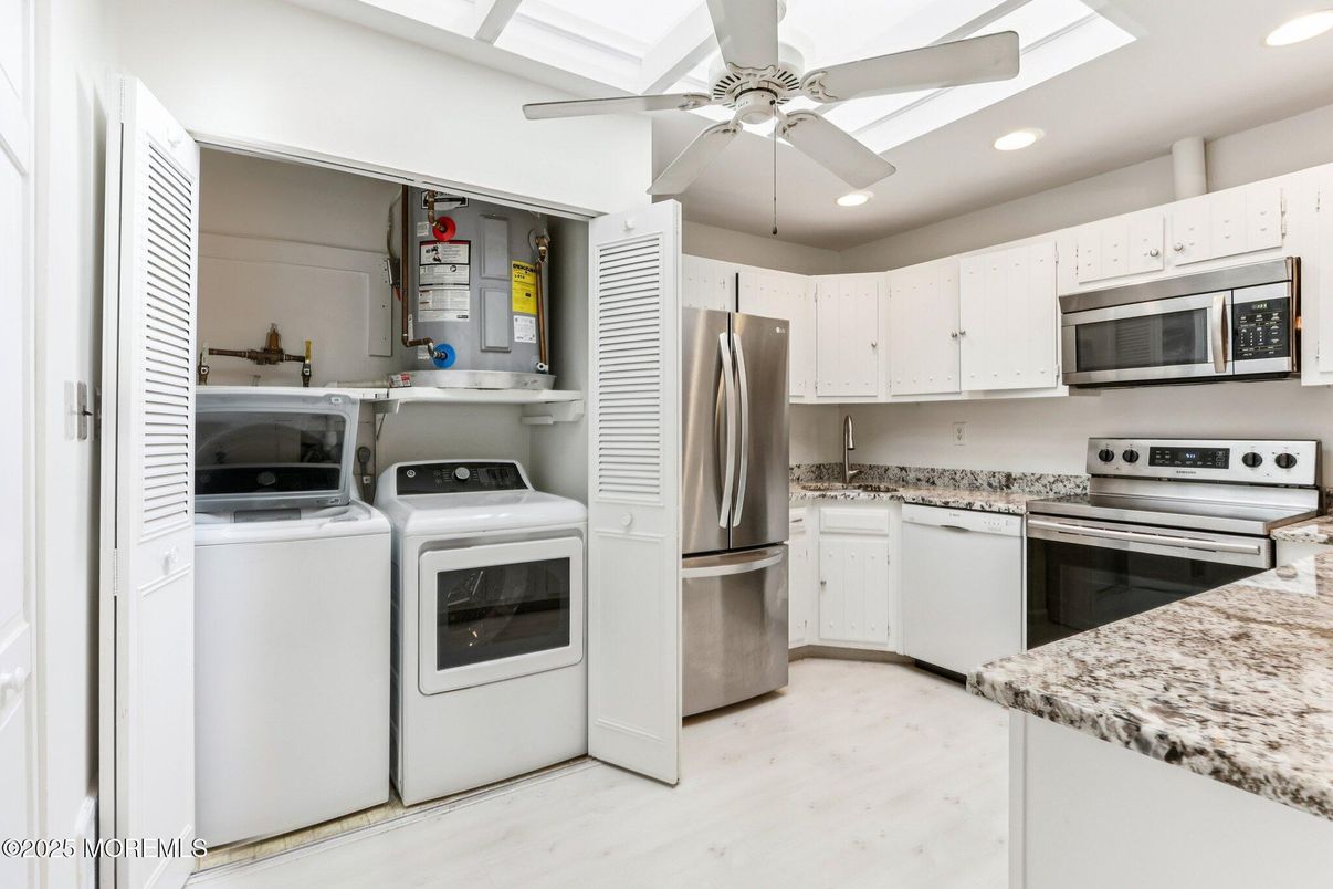 Interior, Kitchen, Recessed Lighting, Stainless Steel Appliances, Washer, Wood Texture Flooring