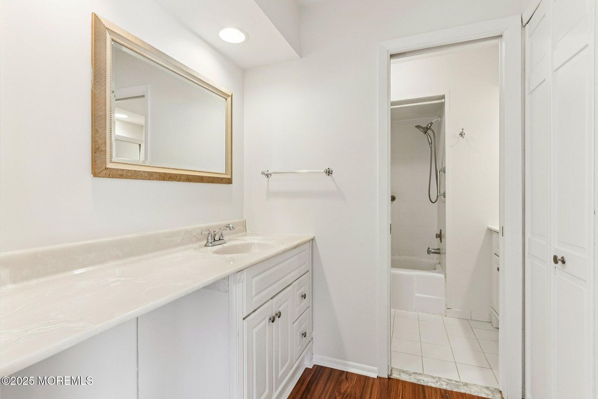 Bathroom, Dual Sink Vanities, Interior, Recessed Lighting, Wood Texture Flooring