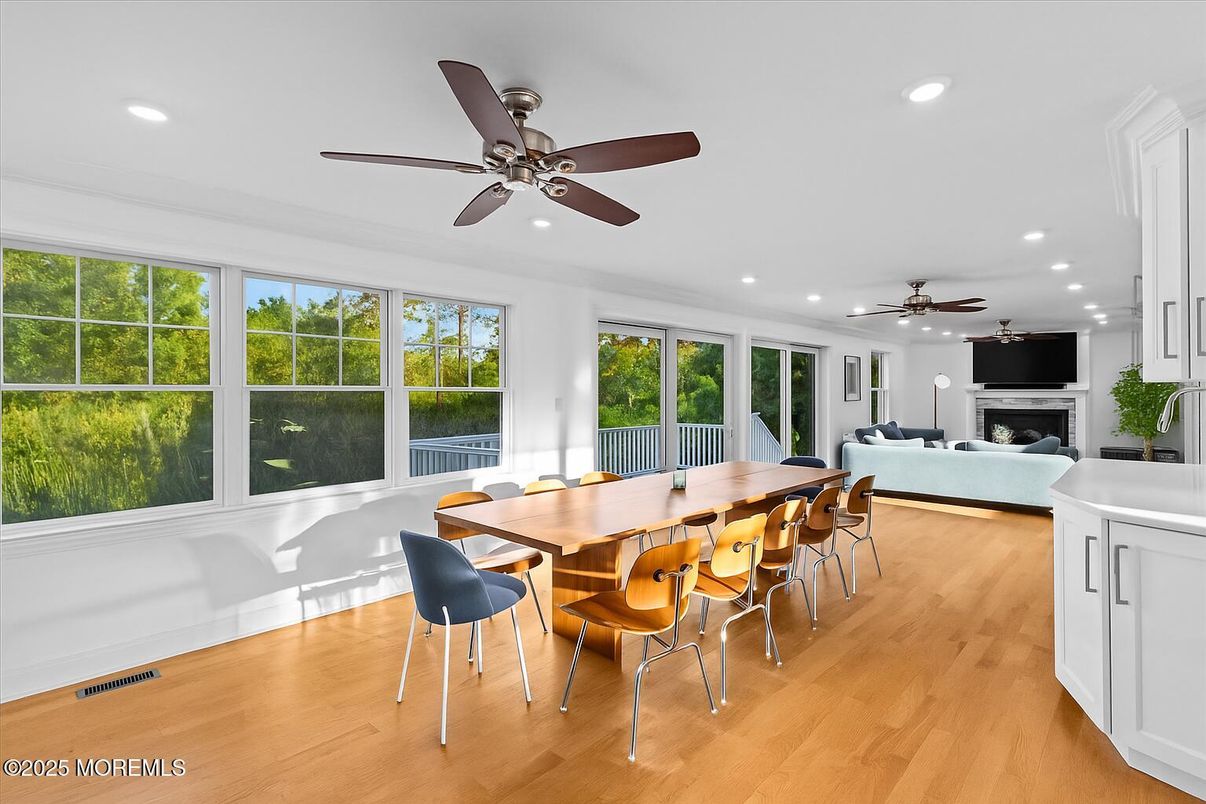 Dining room, Fireplace, Interior, Living room, Recessed Lighting, Wood Texture Flooring