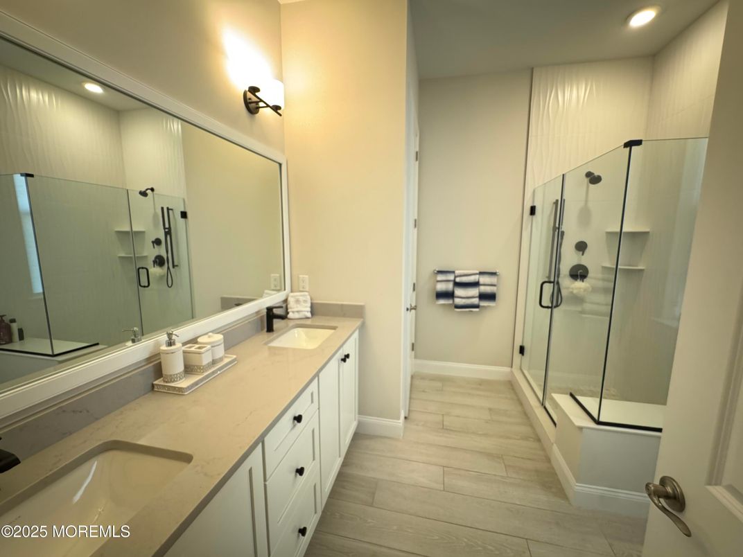 Bathroom, Dual Sink Vanities, Glass Shower, Interior, Recessed Lighting, Wood Texture Flooring
