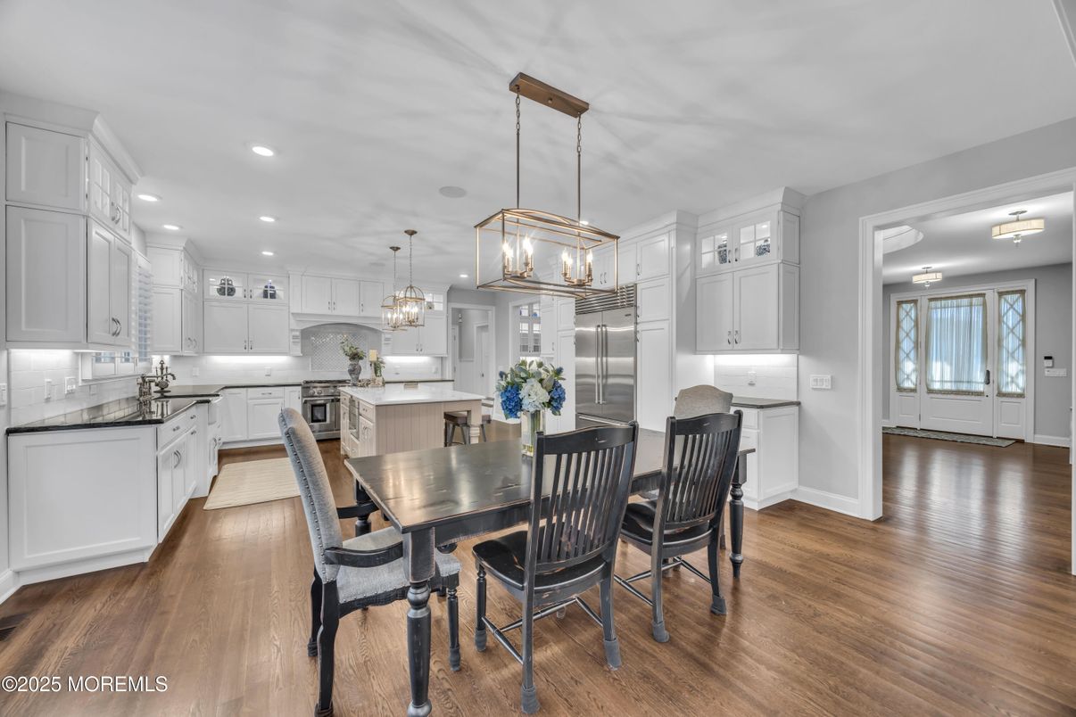 Chandelier, Dining room, Interior, Kitchen, Pendant Lights, Recessed Lighting, Stainless Steel Appliances, Wood Texture Flooring