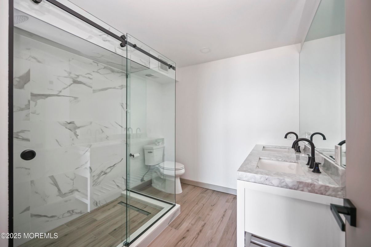 Bathroom, Glass Shower, Interior, Marble Walls, Wood Texture Flooring