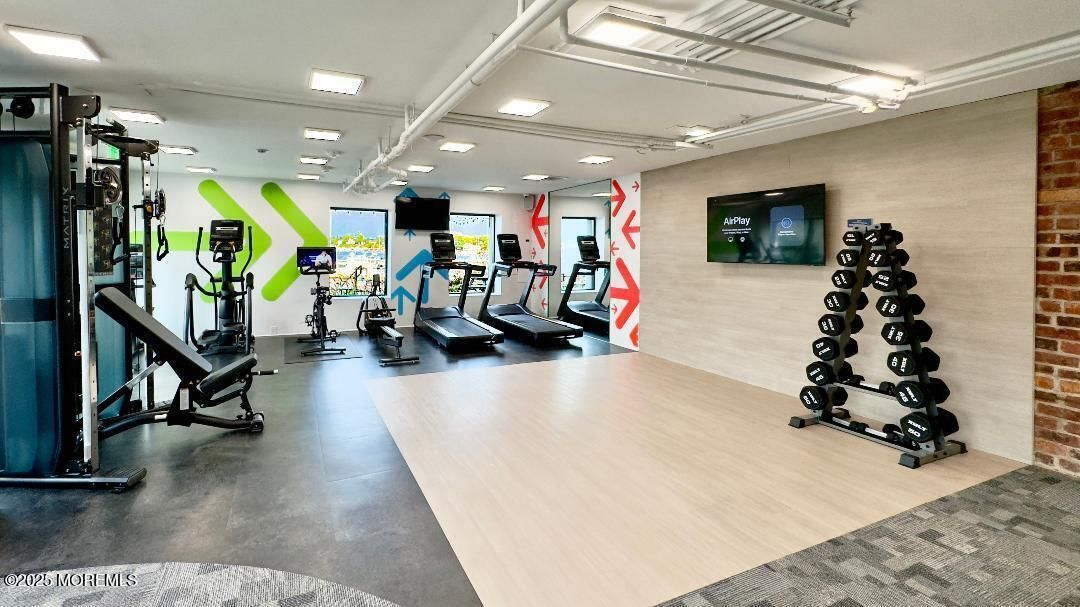 Fitness Equipment, Gym, Interior, Recessed Lighting, Stone Walls, Wood Texture Flooring