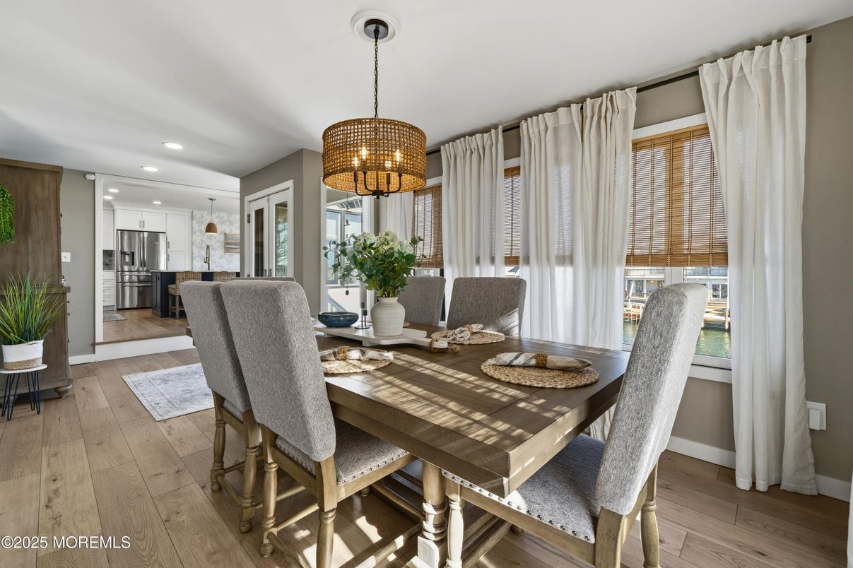Chandelier, Dining room, Interior, Kitchen, Recessed Lighting, Stainless Steel Appliances, Wood Texture Flooring