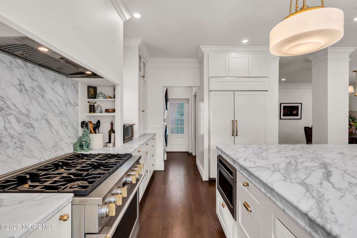 Interior, Kitchen, Marble Walls, Pendant Lights, Recessed Lighting, Stainless Steel Appliances, Wood Texture Flooring