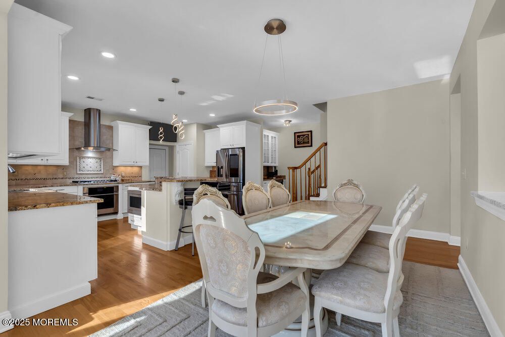 Dining room, Interior, Kitchen, Pendant Lights, Recessed Lighting, Stainless Steel Appliances, Wood Texture Flooring