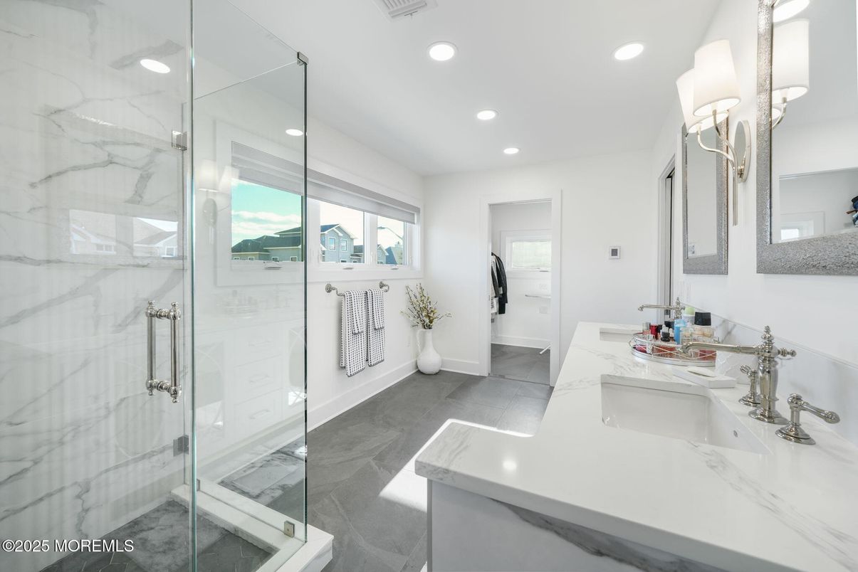 Bathroom, Dual Sink Vanities, Glass Shower, Interior, Marble Walls, Recessed Lighting