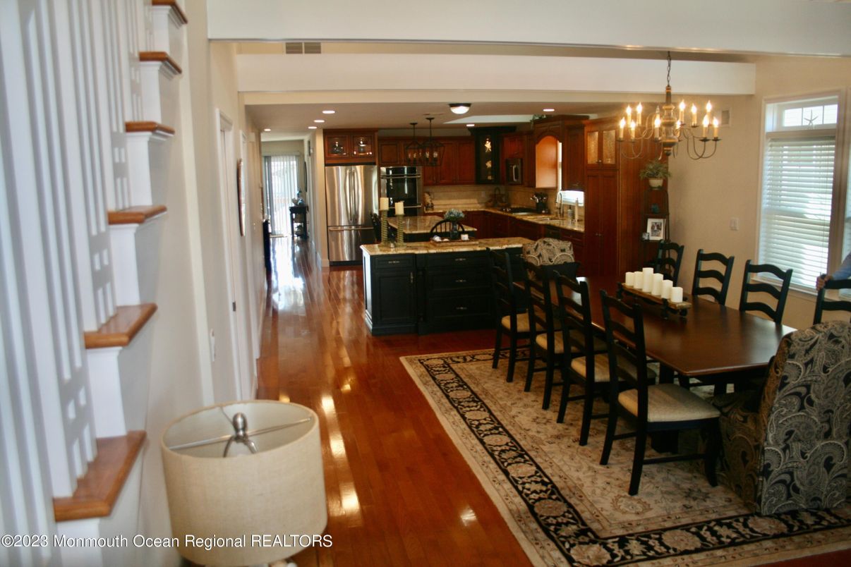 Chandelier, Dining room, Interior, Kitchen, Recessed Lighting, Stainless Steel Appliances, Wood Texture Flooring