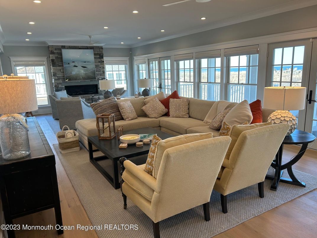 Fireplace, Interior, Living room, Recessed Lighting, Stone Walls, Wood Texture Flooring