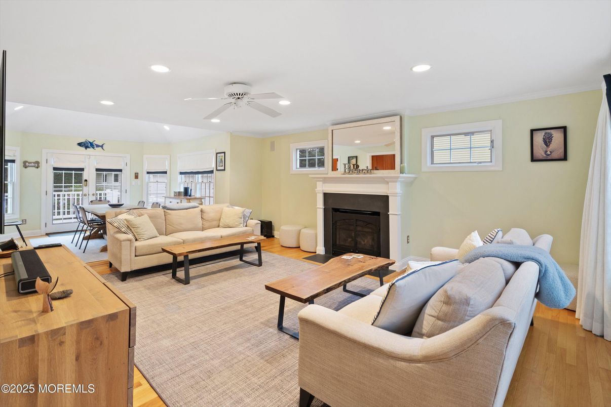 Dining room, Fireplace, Interior, Living room, Recessed Lighting, Wood Texture Flooring