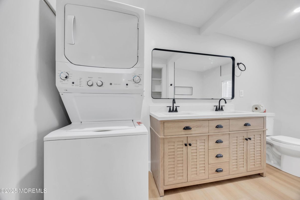 Bathroom, Dual Sink Vanities, Interior, Recessed Lighting, Utility Closets, Washer, Wood Texture Flooring