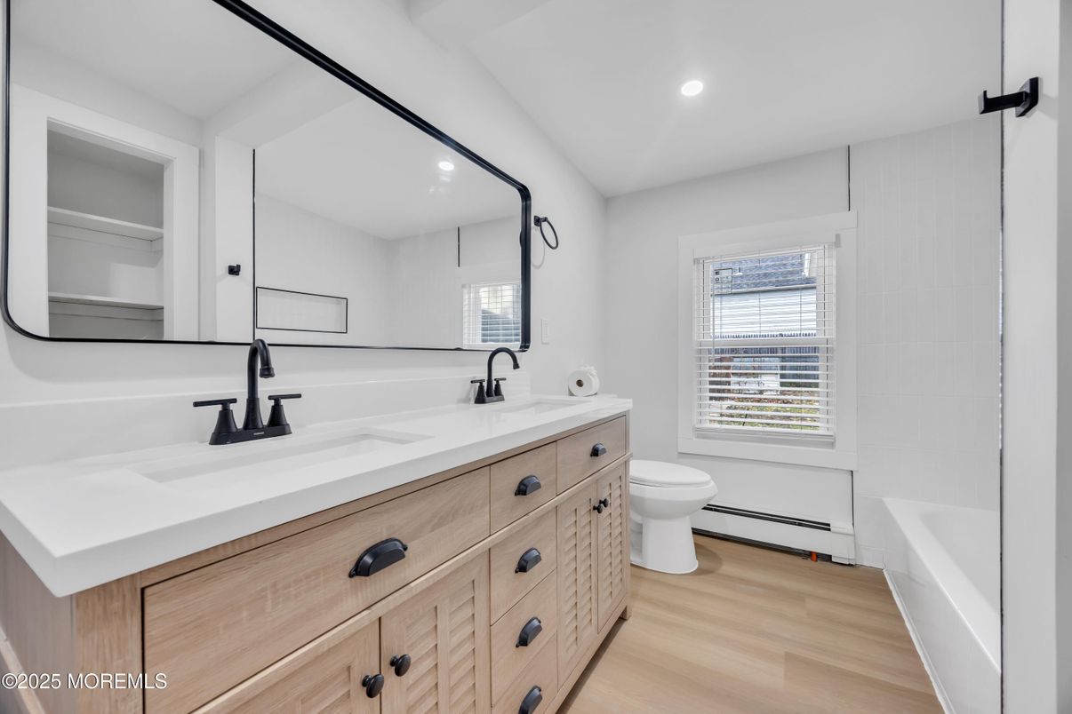 Bathroom, Dual Sink Vanities, Interior, Recessed Lighting, Wood Texture Flooring