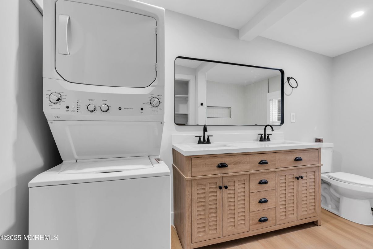 Bathroom, Dual Sink Vanities, Interior, Recessed Lighting, Utility Closets, Washer, Wood Texture Flooring