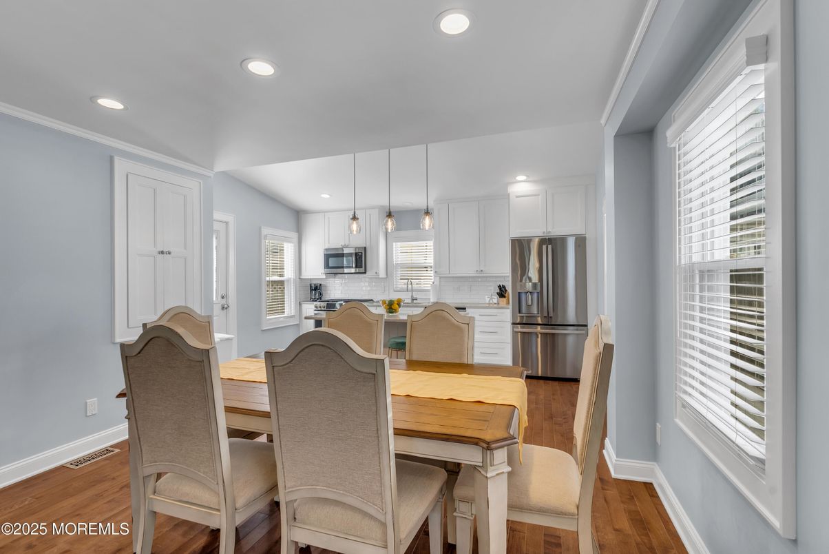 Dining room, Interior, Kitchen, Pendant Lights, Recessed Lighting, Stainless Steel Appliances, Wood Texture Flooring