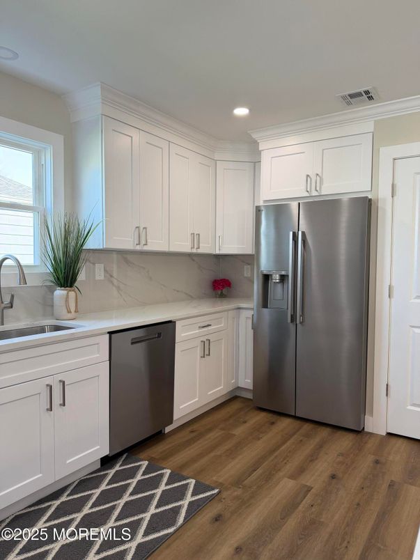 Interior, Kitchen, Marble Walls, Recessed Lighting, Stainless Steel Appliances, Wood Texture Flooring