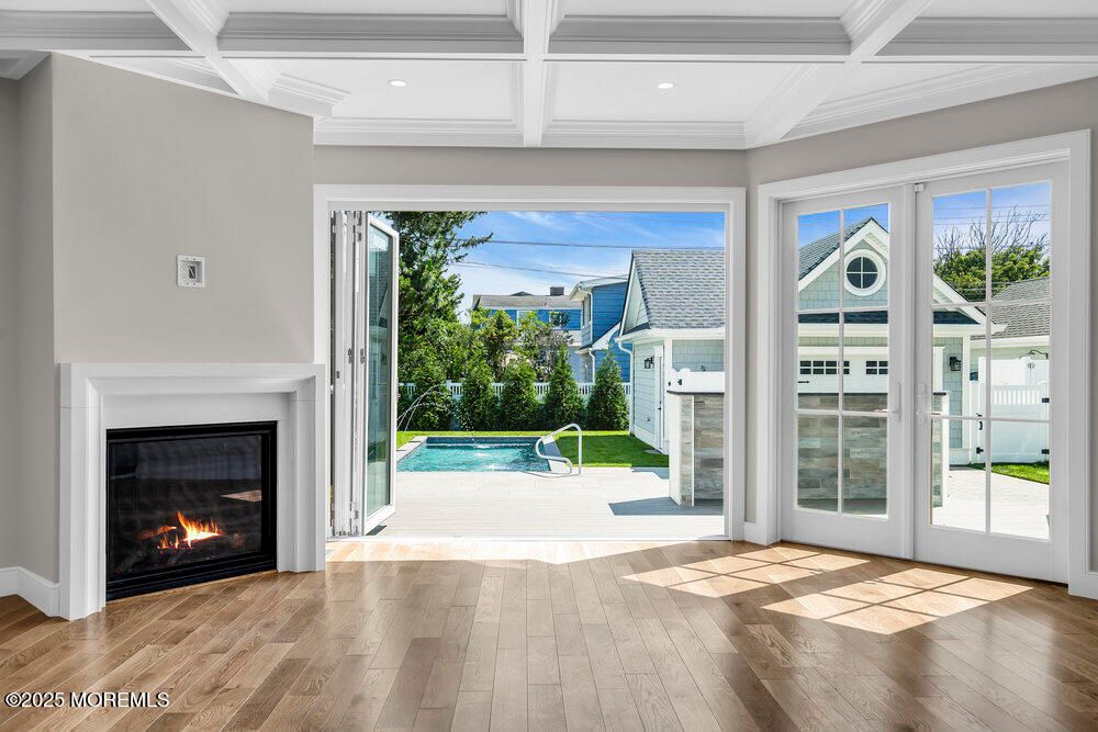 Fireplace, Interior, Pool, Recessed Lighting, Wood Texture Flooring