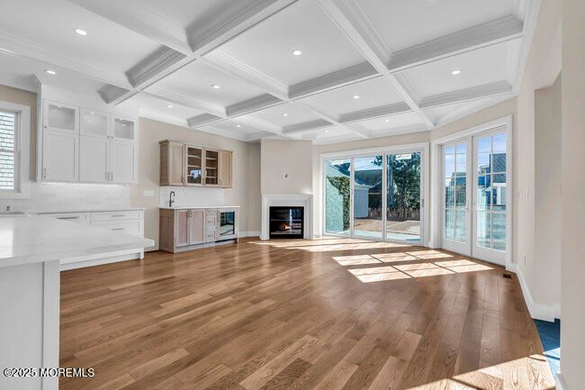 Empty room, Fireplace, Interior, Kitchen, Recessed Lighting, Wood Texture Flooring