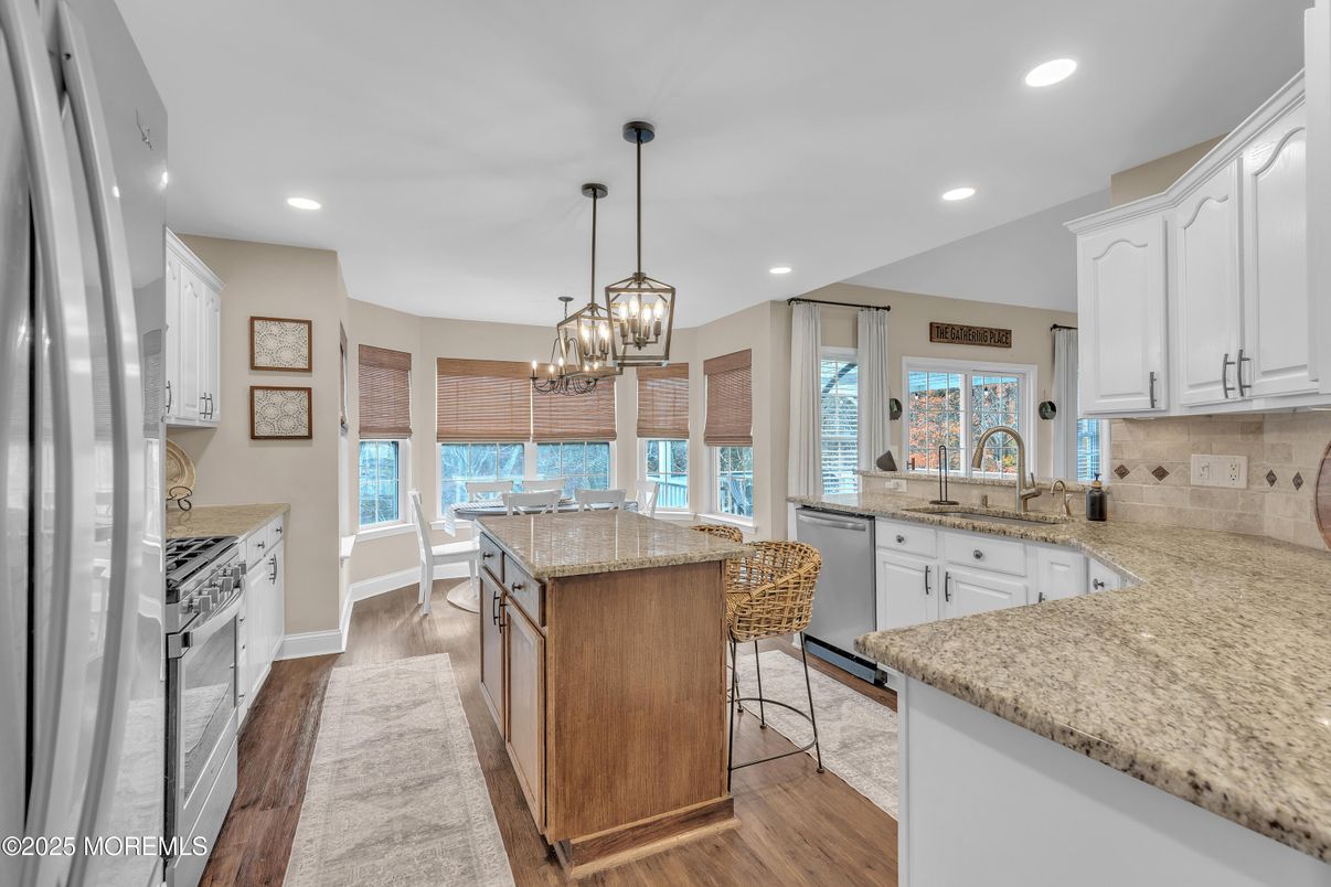 Chandelier, Dining room, Interior, Kitchen, Pendant Lights, Recessed Lighting, Stainless Steel Appliances, Wood Texture Flooring