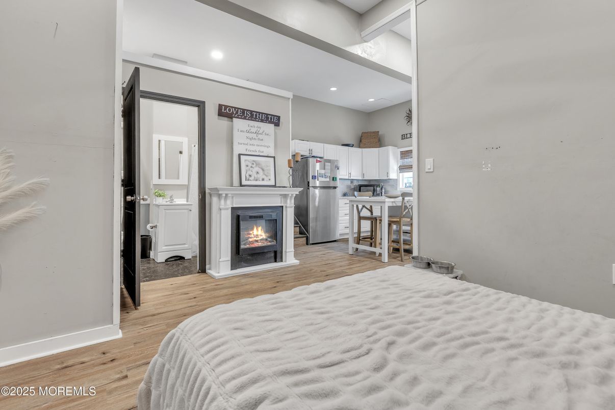 Bedroom, Fireplace, Interior, Recessed Lighting, Wood Texture Flooring