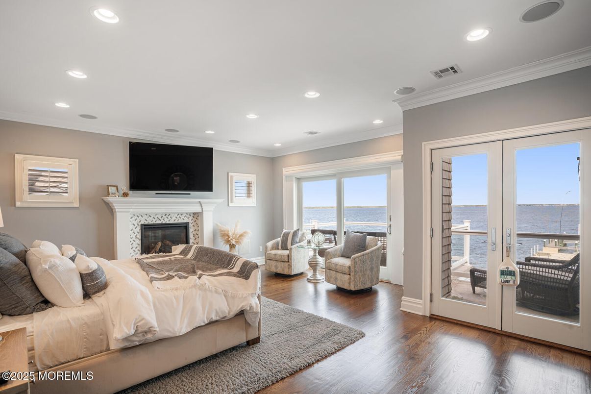 Bedroom, Fireplace, Interior, Recessed Lighting, Water, Wood Texture Flooring