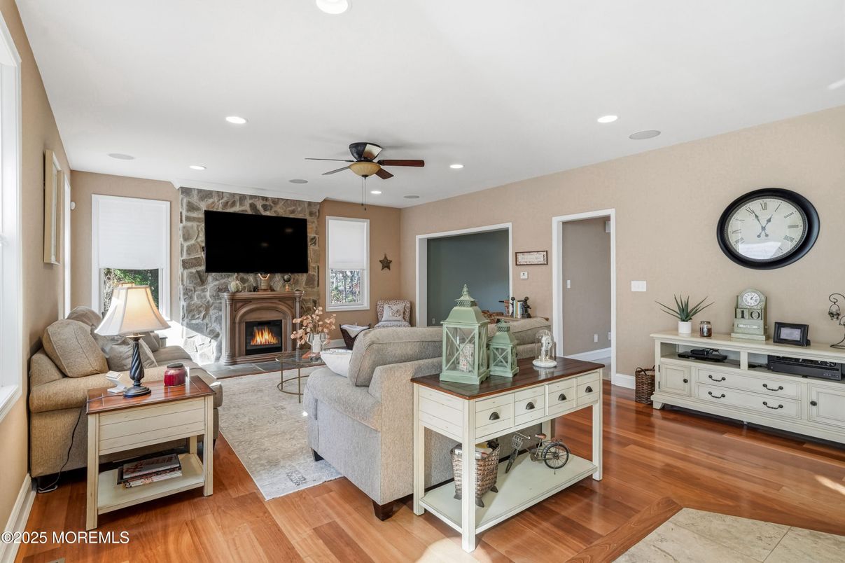 Fireplace, Interior, Living room, Recessed Lighting, Stone Walls, Wood Texture Flooring