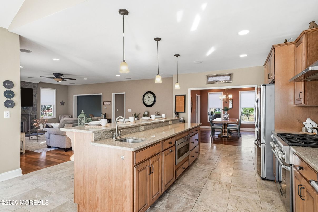 Chandelier, Dining room, Fireplace, Interior, Kitchen, Living room, Pendant Lights, Recessed Lighting, Wood Texture Flooring