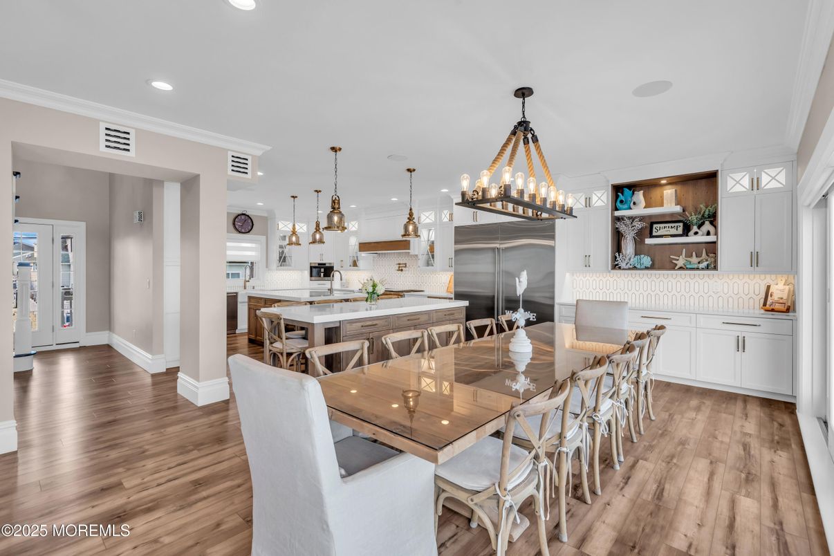 Dining room, Interior, Kitchen, Pendant Lights, Recessed Lighting, Stainless Steel Appliances, Wood Texture Flooring