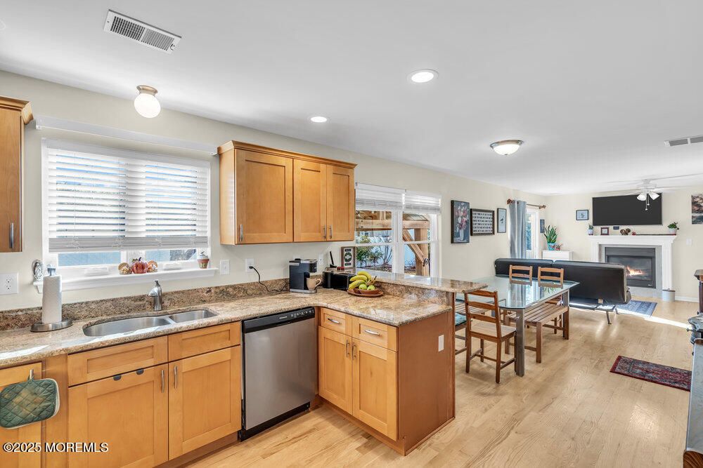 Dining room, Fireplace, Interior, Kitchen, Living room, Recessed Lighting, Wood Texture Flooring