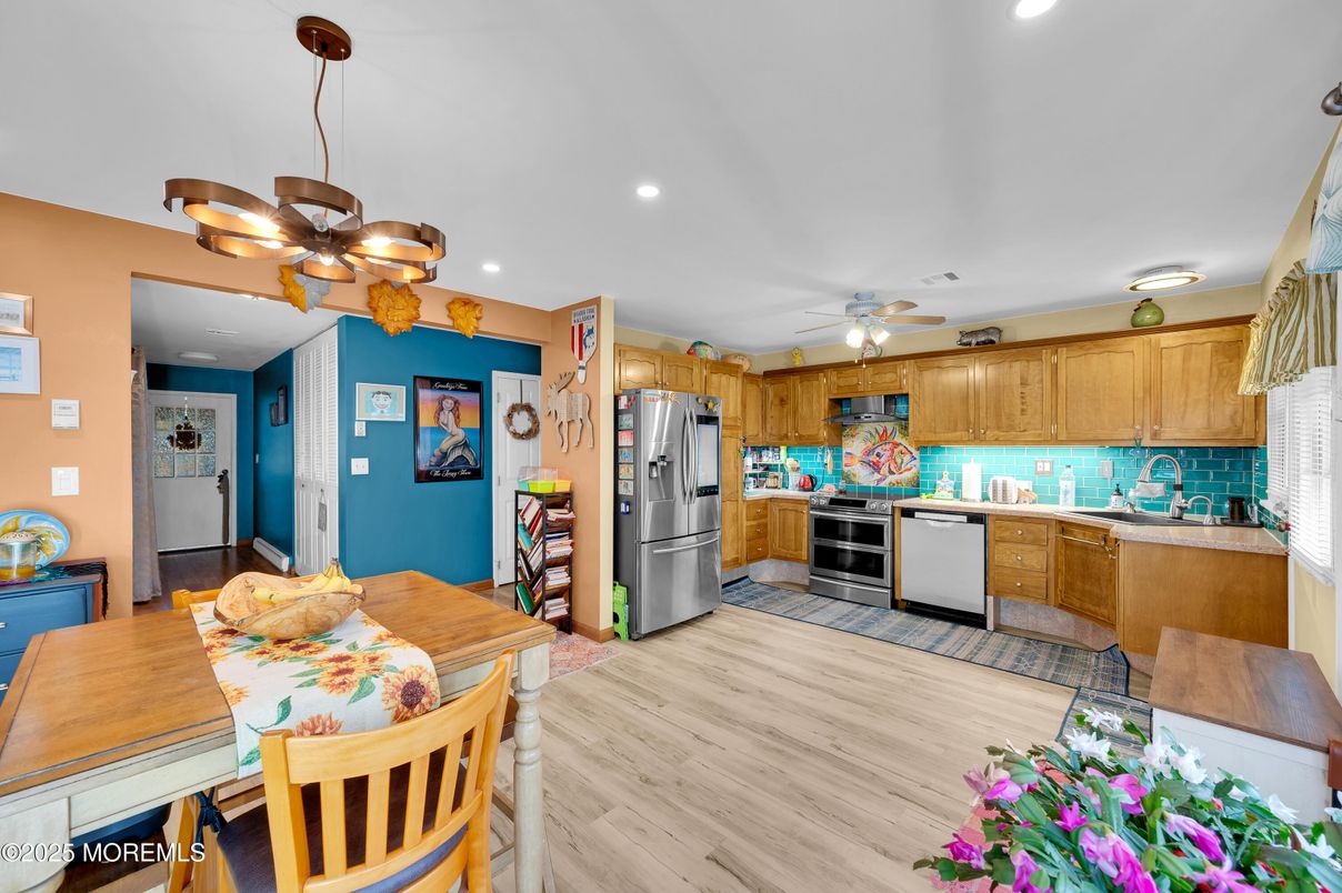 Dining room, Interior, Kitchen, Pendant Lights, Recessed Lighting, Stainless Steel Appliances, Wood Texture Flooring
