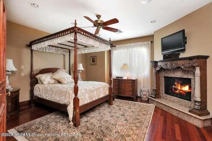Bedroom, Fireplace, Interior, Recessed Lighting, Wood Texture Flooring