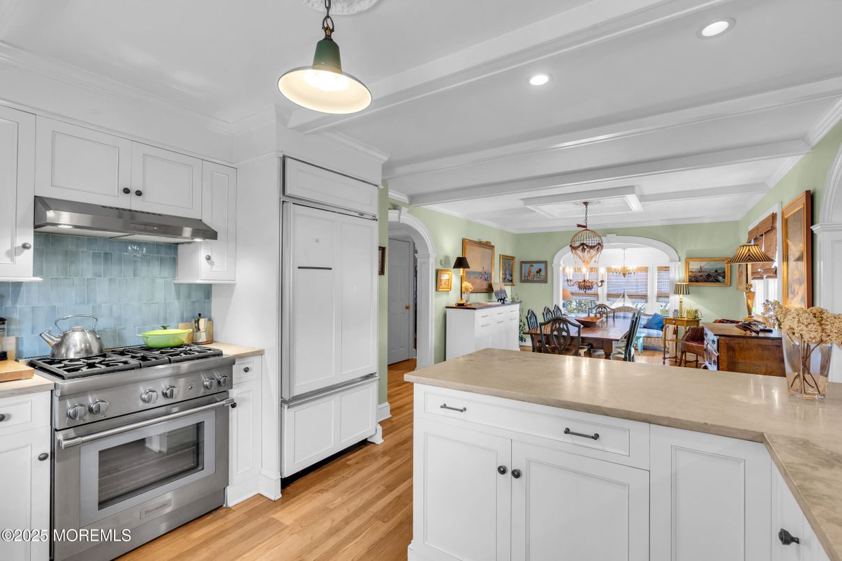 Chandelier, Dining room, Interior, Kitchen, Pendant Lights, Recessed Lighting, Stainless Steel Appliances, Wood Texture Flooring