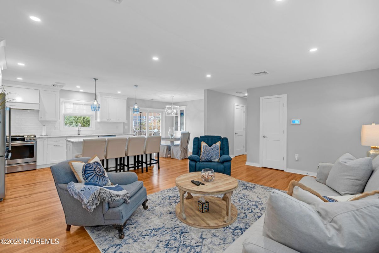 Dining room, Interior, Kitchen, Living room, Pendant Lights, Recessed Lighting, Stainless Steel Appliances, Wood Texture Flooring