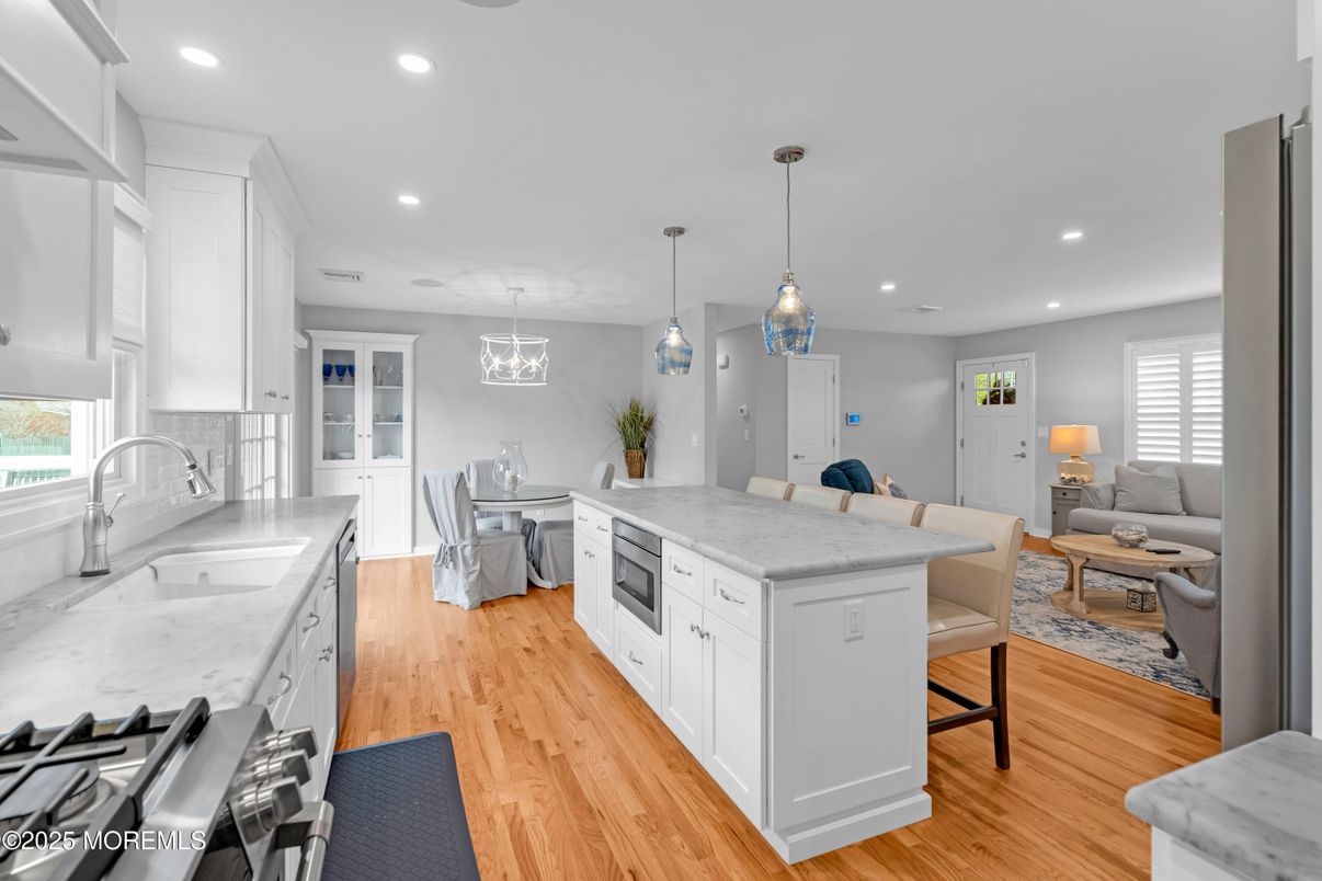 Dining room, Interior, Kitchen, Living room, Pendant Lights, Recessed Lighting, Stainless Steel Appliances, Wood Texture Flooring