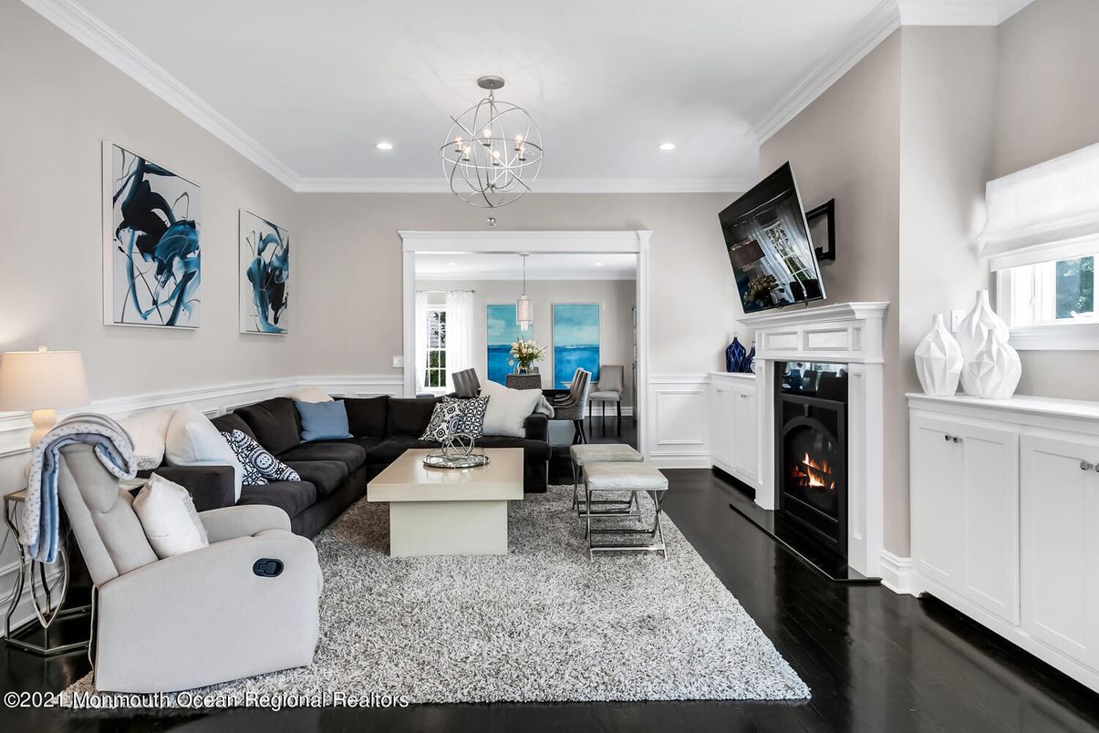 Chandelier, Fireplace, Interior, Living room, Recessed Lighting, Water, Wood Texture Flooring