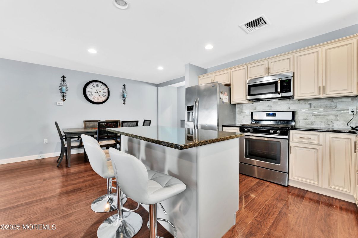 Dining room, Interior, Kitchen, Recessed Lighting, Stainless Steel Appliances, Wood Texture Flooring
