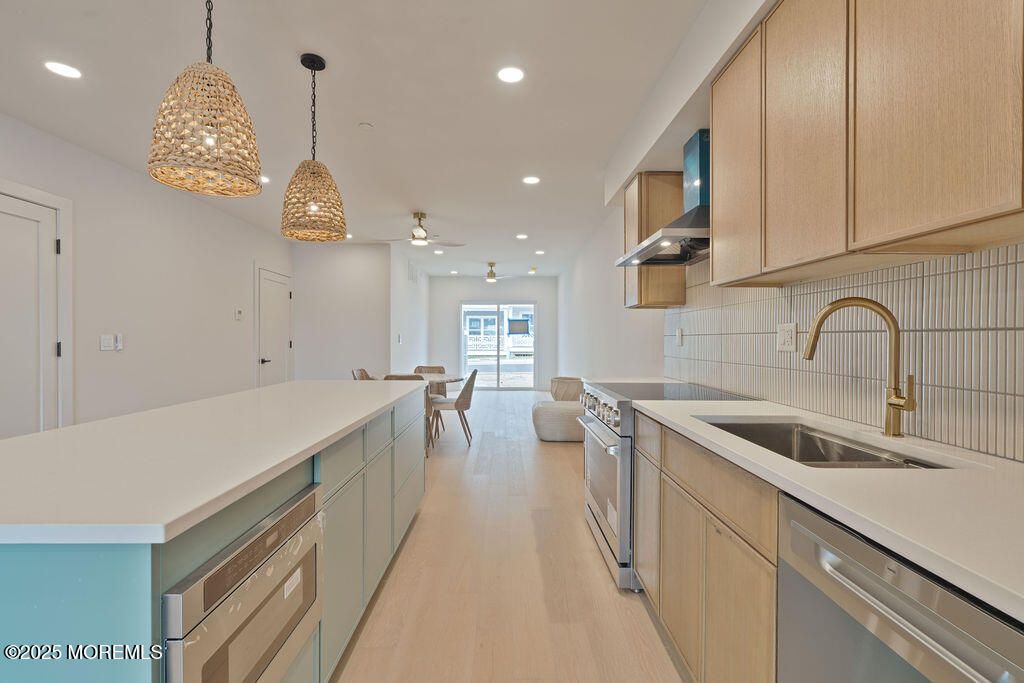 Dining room, Interior, Kitchen, Pendant Lights, Recessed Lighting, Stainless Steel Appliances, Wood Texture Flooring