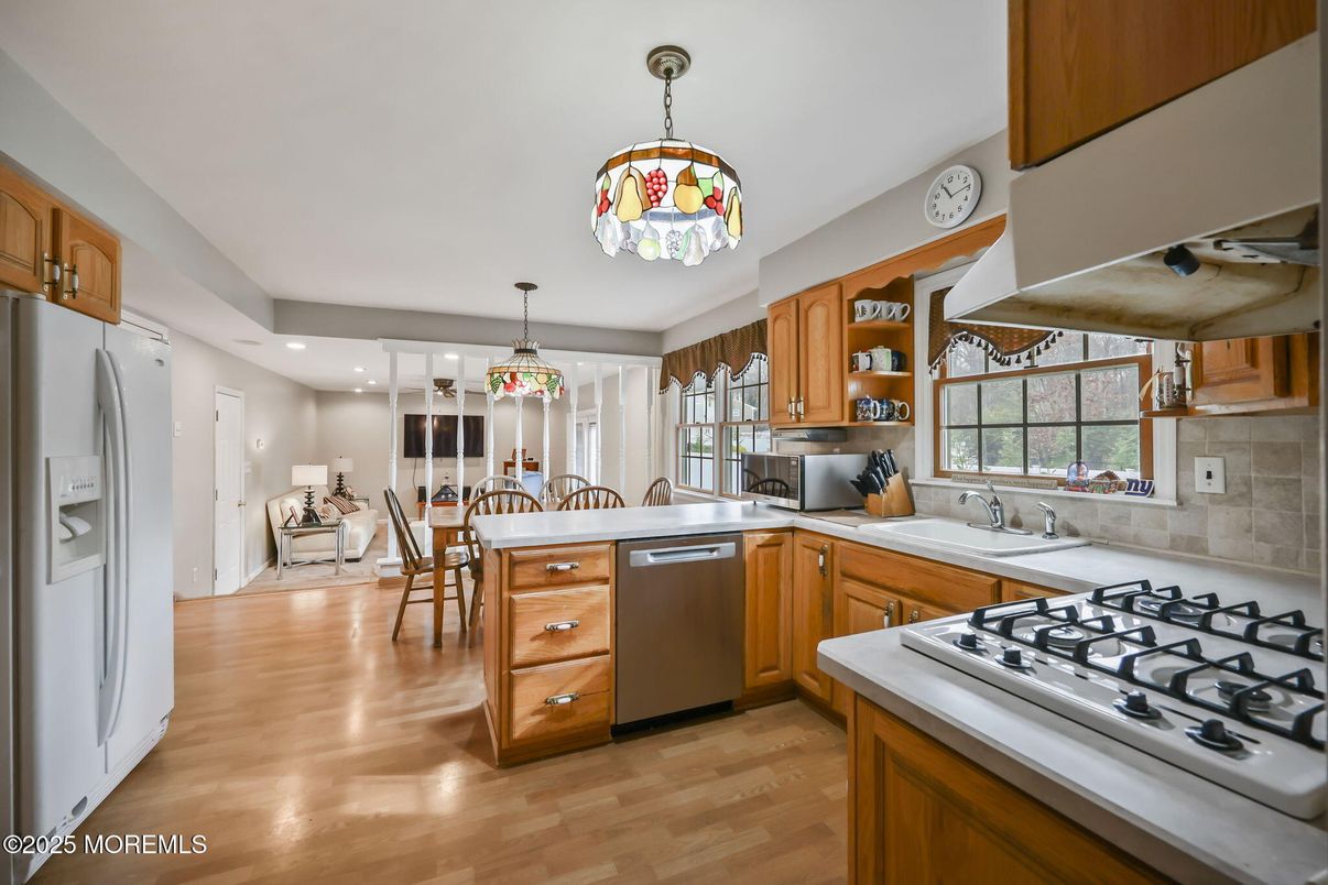 Dining room, Interior, Kitchen, Pendant Lights, Recessed Lighting, Stainless Steel Appliances, Wood Texture Flooring
